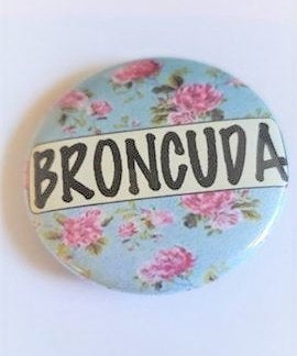 BRONCUDA Flower PIN BUTTON black font on blue and pink flowers 1.5"