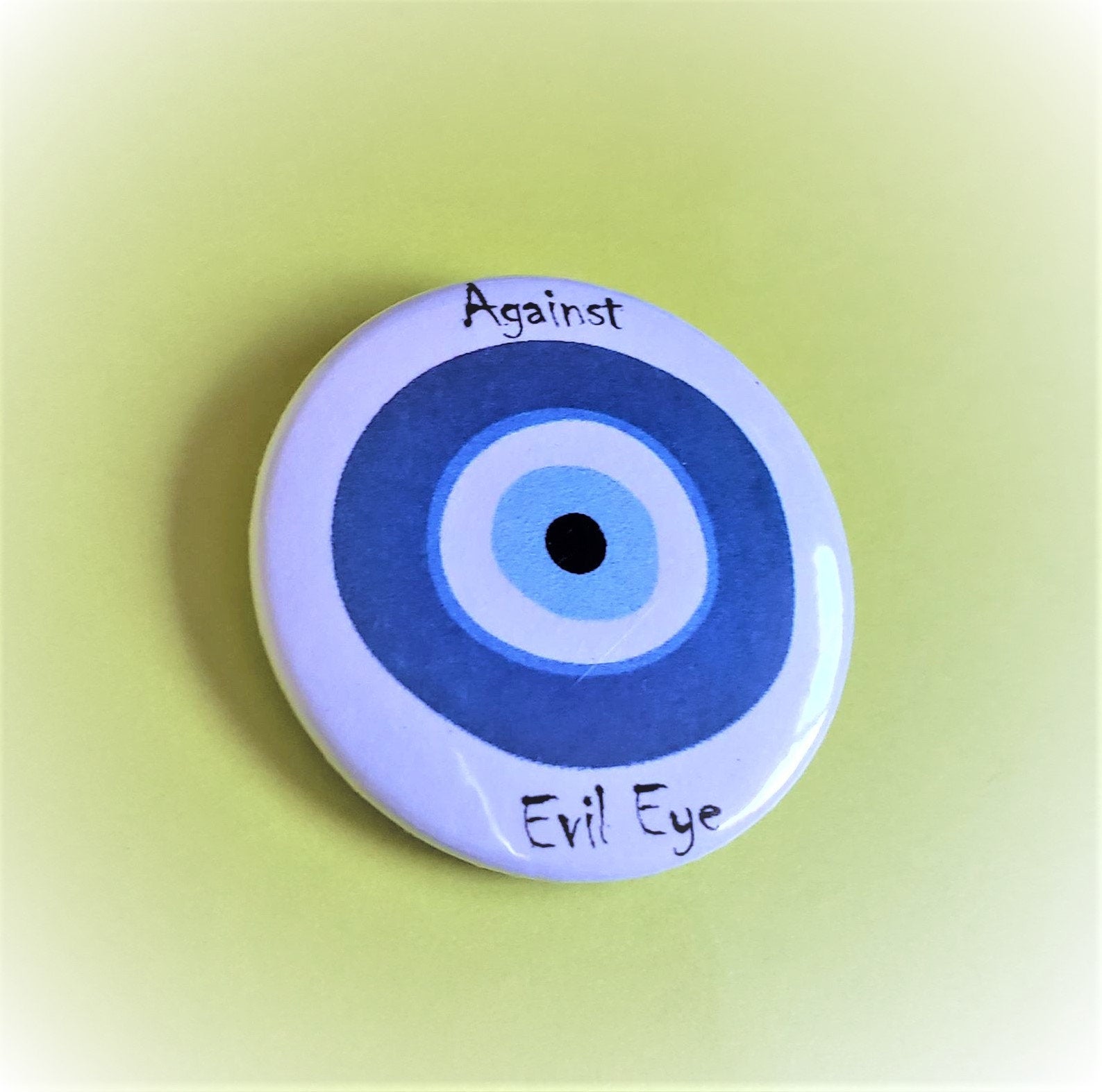 AGAINST EVIL EYE PIn Button 1.5"