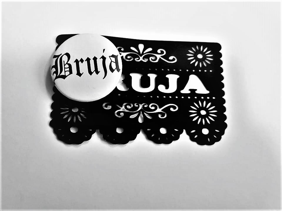 BRUJA PIN BUTTON black font on white 1.5"