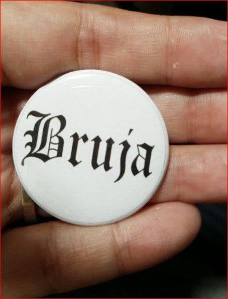 BRUJA PIN BUTTON black font on white 1.5"