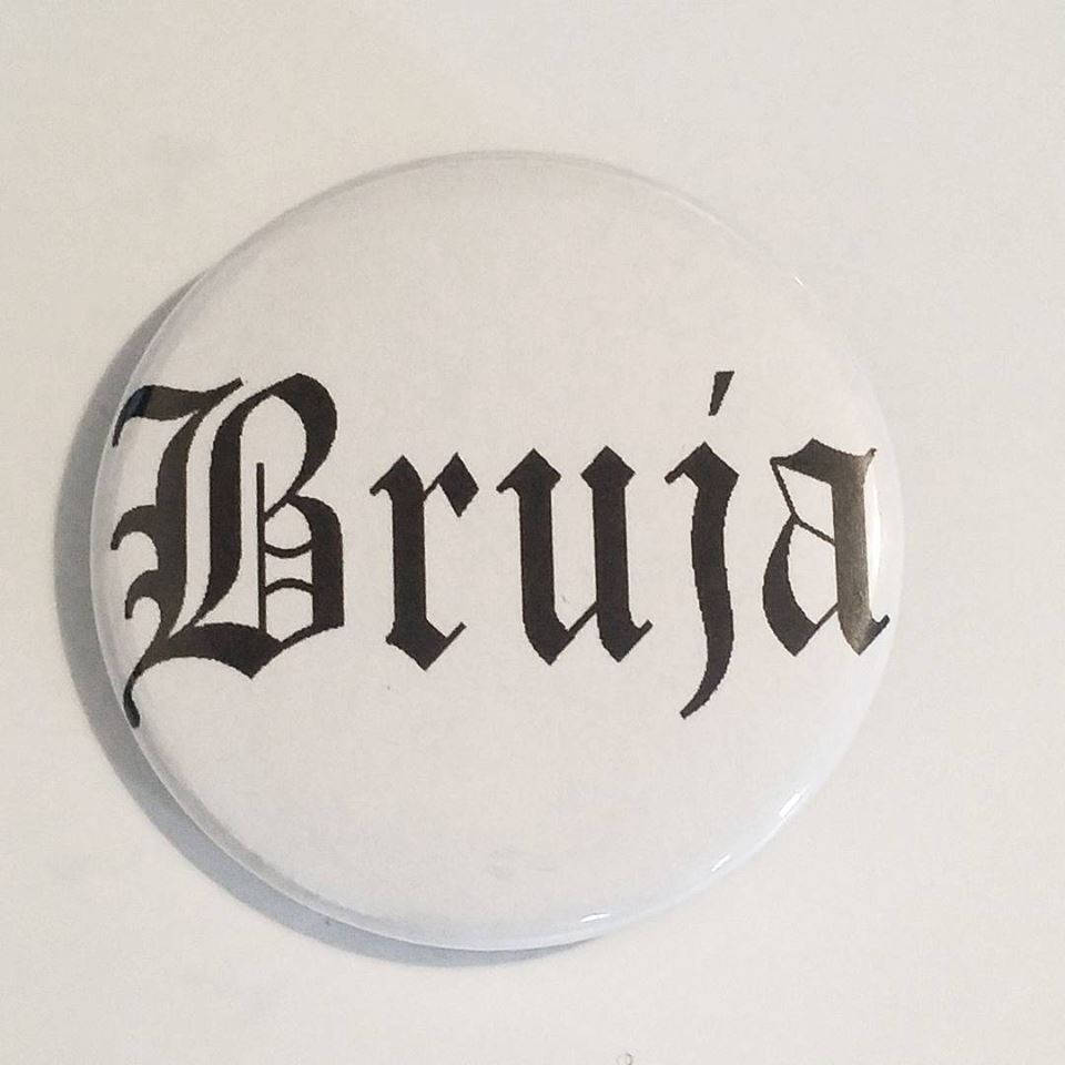 BRUJA PIN BUTTON black font on white 1.5"